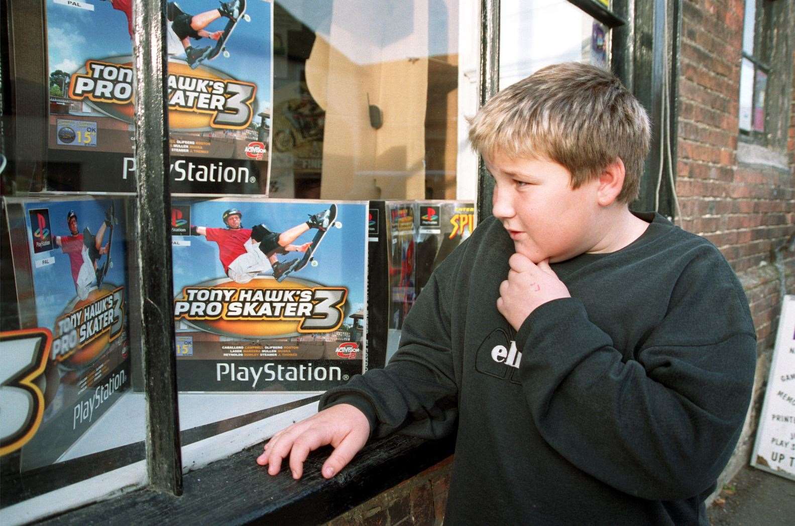 Lewis Hambley, 11, window shopping for Christmas in New Romney in 2001