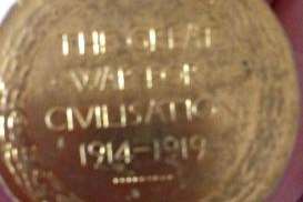The inscription '42900 PTE. T.S.D. CHEESEMAN ESSEX Regiment' is visible around the medal's edge