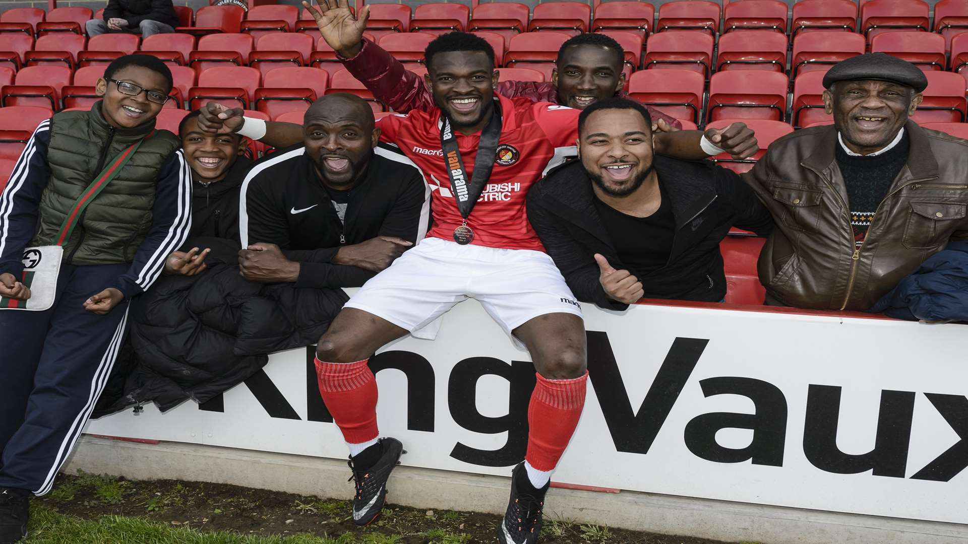 All smiles after the game as Anthony Cook celebrates promotion with his loved ones Picture: Andy Payton