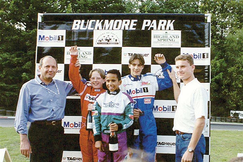 Lewis Hamilton, centre, at Buckmore Park aged 12 in 1996, with David Coulthard, far right, and McLaren boss Ron Dennis, far left