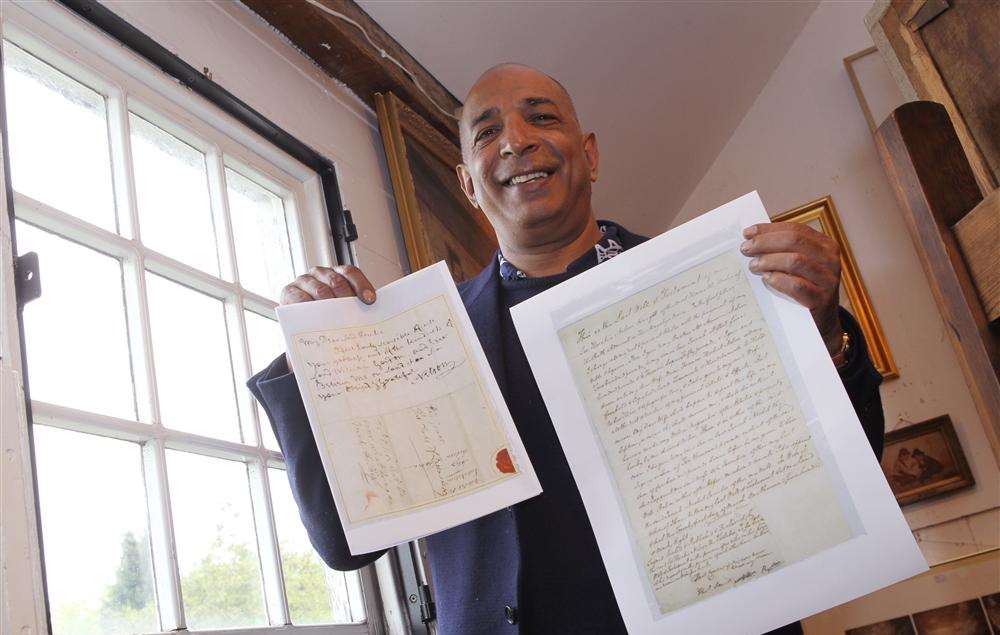 Bentley's Auction House owner Raj Bisram with copies of Nelson's will