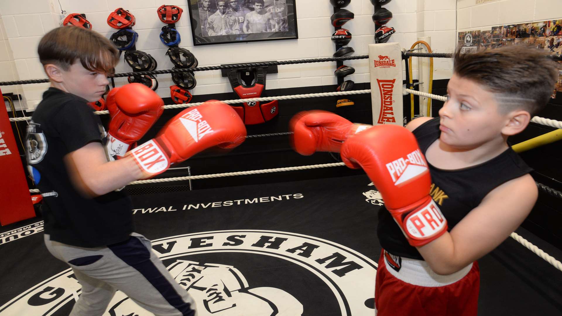 Aaron Issac, 13, and Levi Brazil, 10, sparing in the ring