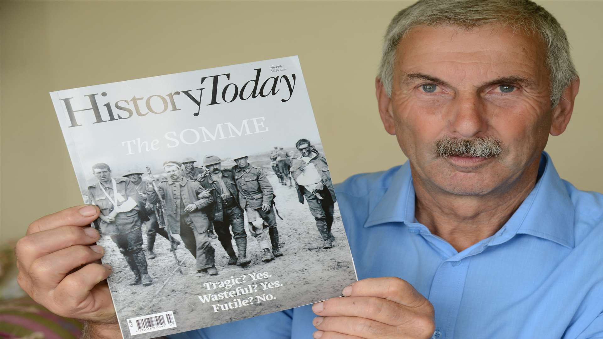 Richard Hopkins, with a copy of History Today, featuring the image of his grandfather