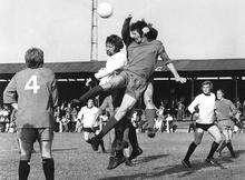 Les Burns in the white shirt going up for a header during the 1971-72 FA Cup tie, Dartford v Walton &amp; Hersham