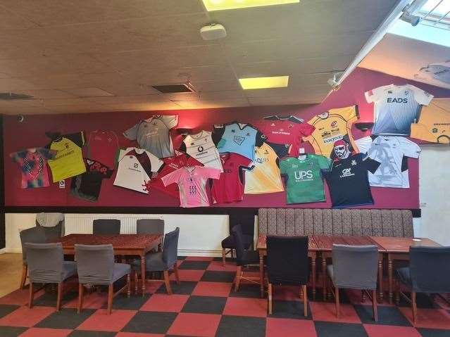 A collection of shirts on the wall of the clubhouse including Scotland, Ireland and even one from Kenya.