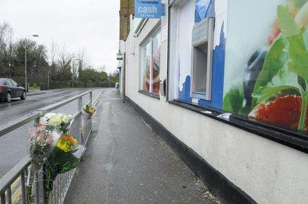 Views of the floral tributes at the scene of a serious assault in Church Road, Murston, outside the Co-Operative store. A murder investigation is now in progress after the victim, Adrian Milner, died in hospital.