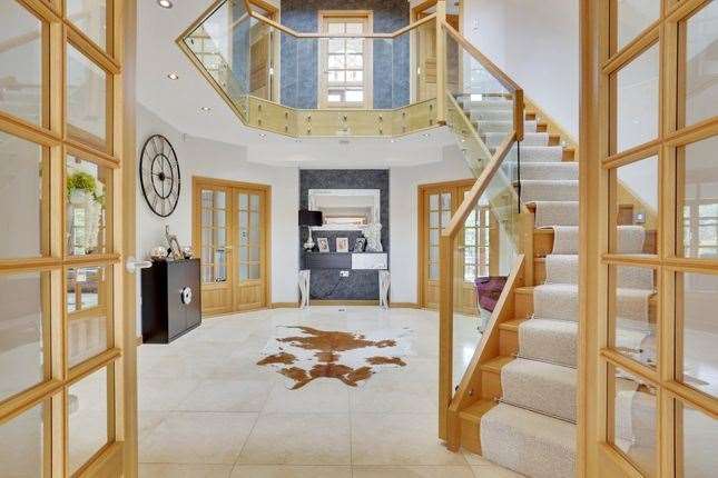 The central hall atrium is a striking feature of the house. Picture: Zoopla / Fine & Country