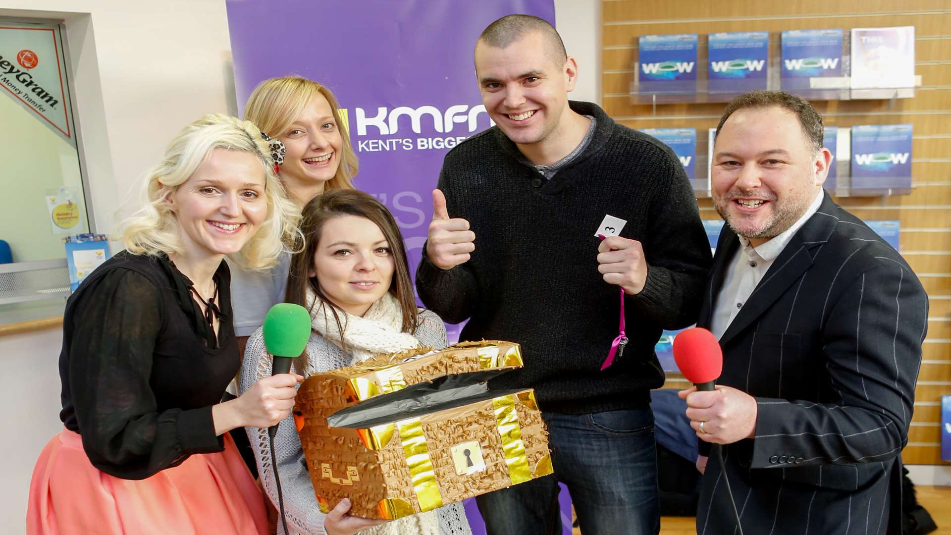 Presenters Emma Adam and Garry Wilson with winner Simon Sherwood, his partner Lauren Ramos and Thomas Cook store manager Abigail Webster