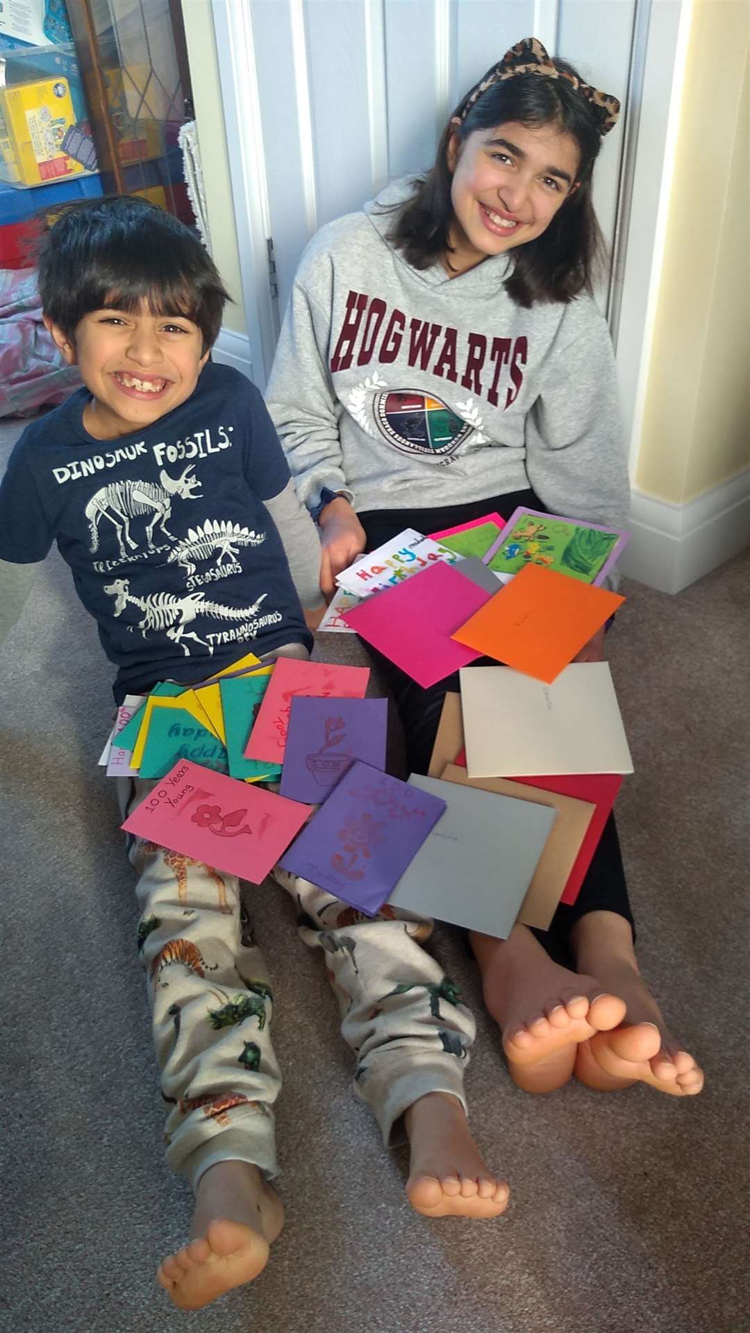 Blanche's great-grandchildren, Amelia and Isaac, with birthday cards for their great-nan's 100th birthday