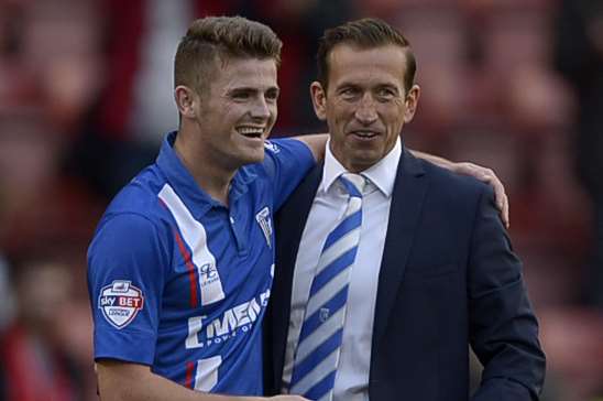 Rory Donnelly and Gills boss Justin Edinburgh Picture: Barry Goodwin