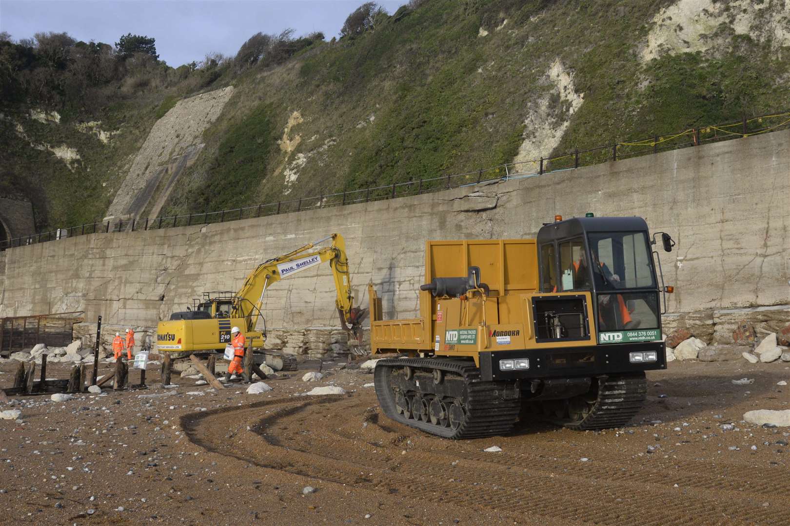 Repair work is underway on the damaged sea wall and railway embankment near Shakespeare Cliff tunnel between Dover and Folkestone