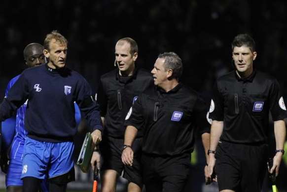 Assistant manager John Schofield in debate with referee Brendan Malone Pic: Barry Goodwin