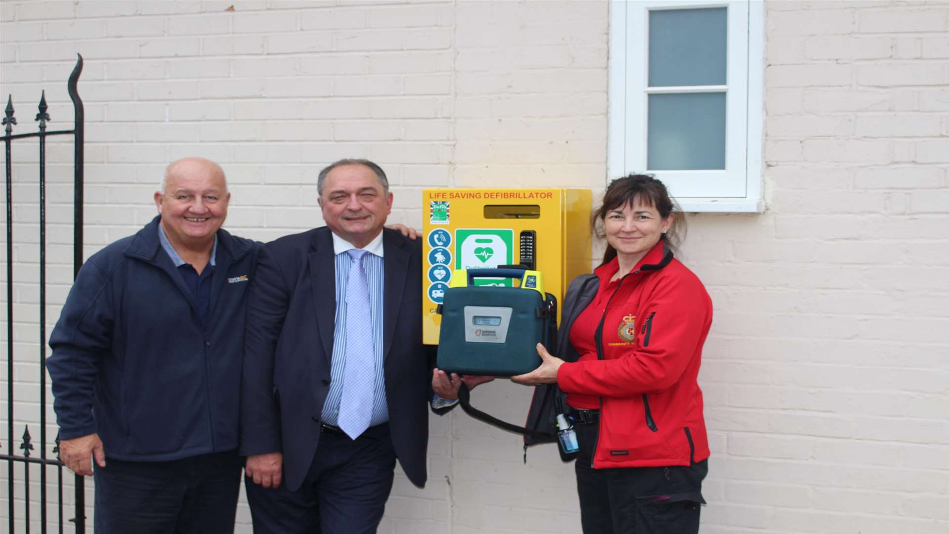 First aid trainer David Pinkney, pub owner John Walsh and first responder Zella Nerssessian with the new defibrillator outside The Five Bells in Ringwould