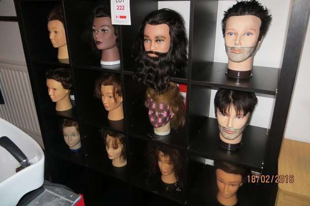 12 head manikins are featured in a lot and thought to have been used for teaching hairdressing