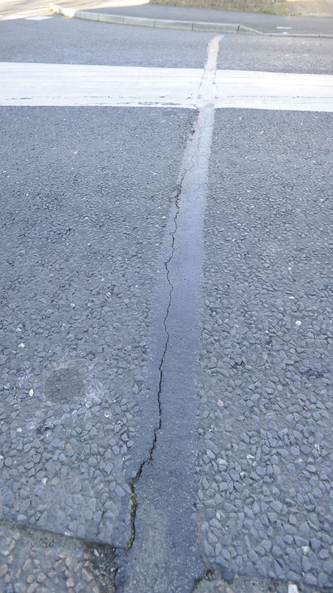 Large cracks have appeared in the road.