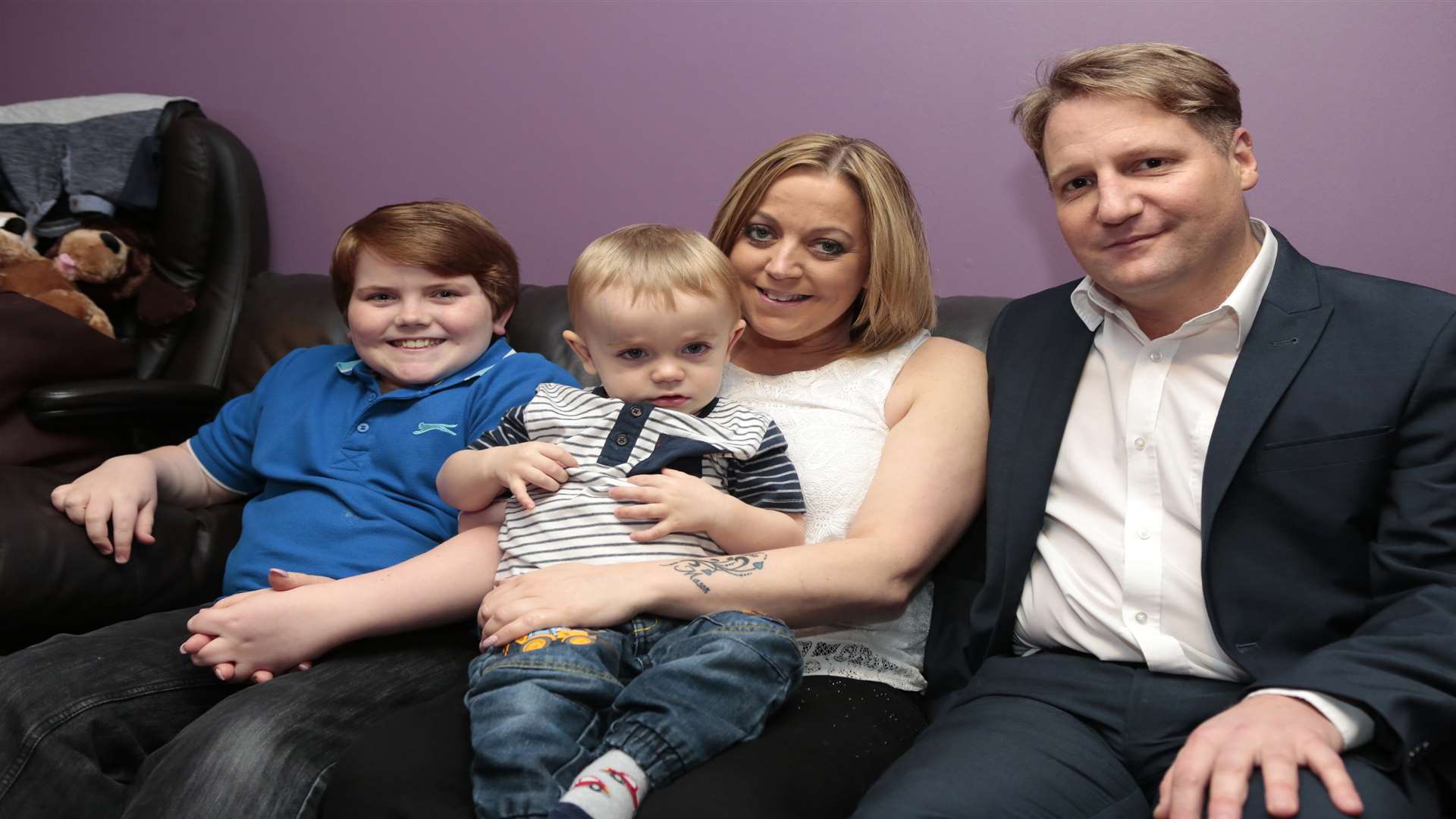 Rebecca Watts with her two sons, Alfie and Mason, and her boyfriend Richard Munn