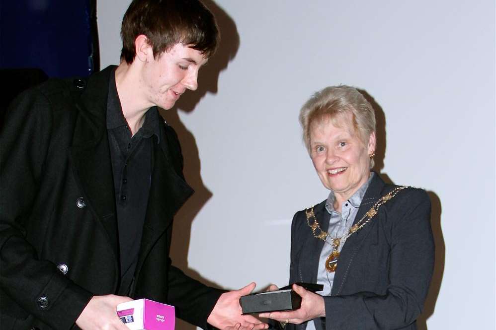 One of the 2012 winners, Peter Silk, accepting his senior award from last year's Mayoress of Swale Cllr Sylvia Bennett