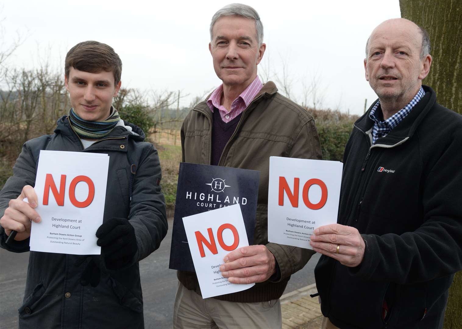 Jack Lowe, Dave Durell and David Humphries show opposition to the proposals at the consultation into the Highland Farm development