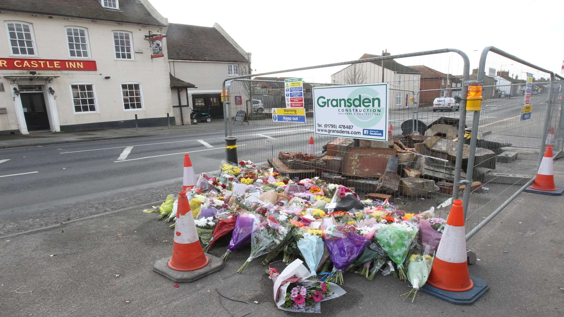 Flowers left at the ruins of the pump following the tragic crash