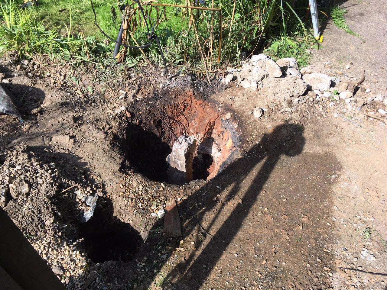 The hole left after the pipe was damaged