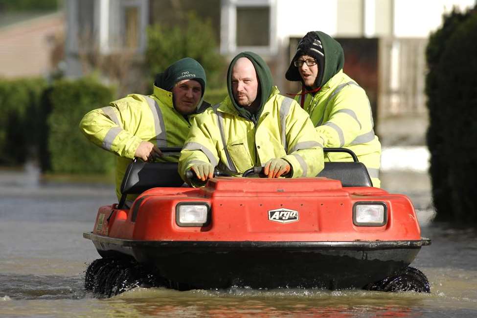 Staff evacuating the Little Venice caravan park in Yalding yesterday