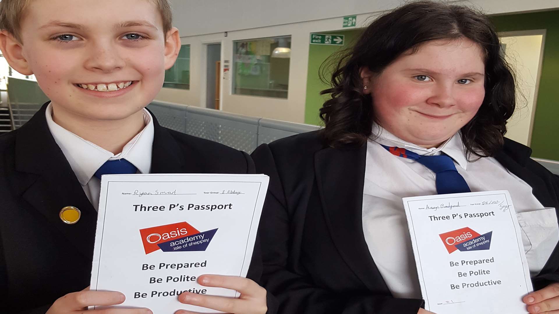 Ryan Smart, 12, and Anwyn Bradford, 13 with their passports