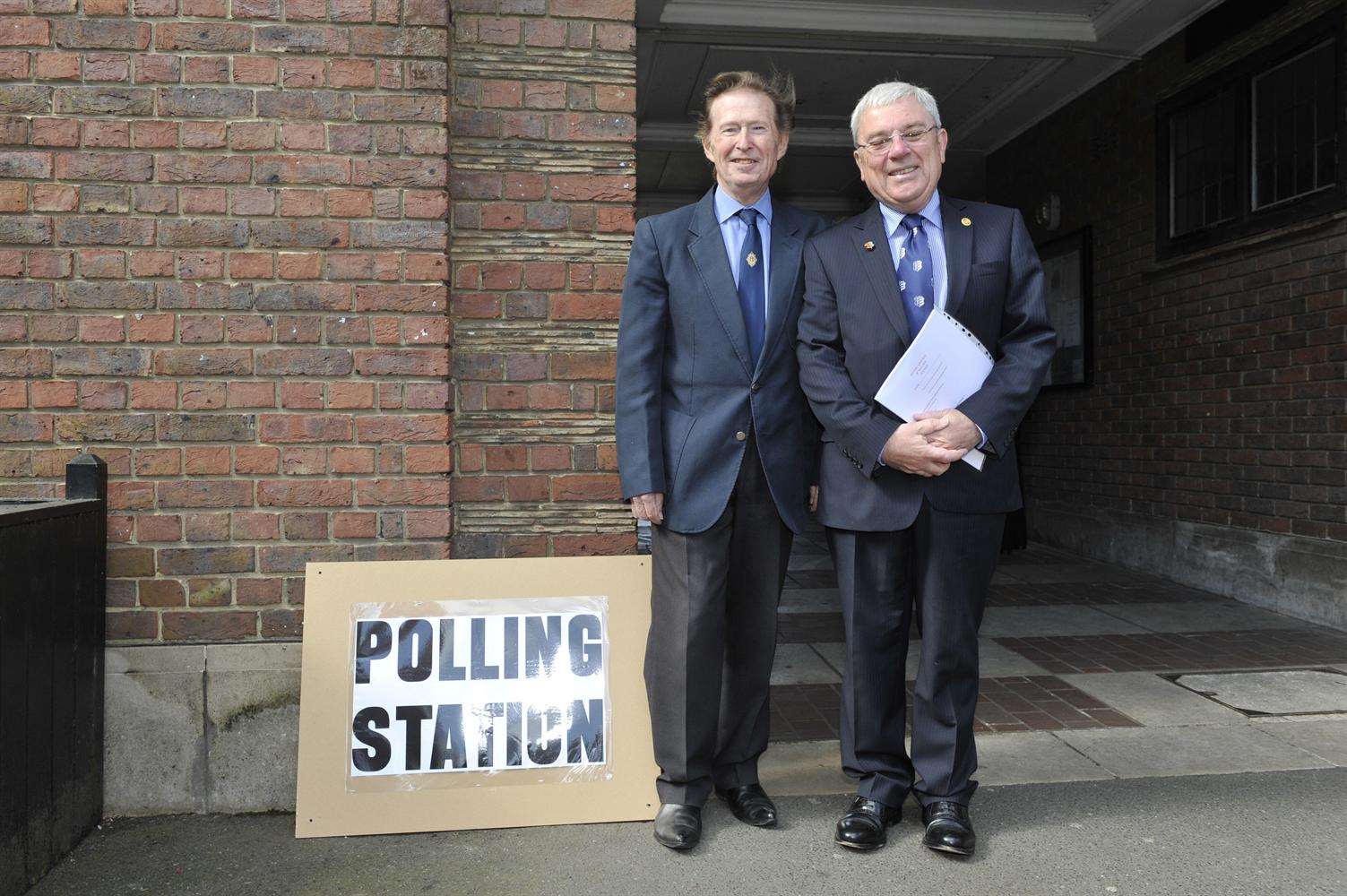 Former councillor Bernard Butcher and Cllr Paul Graeme casting their votes