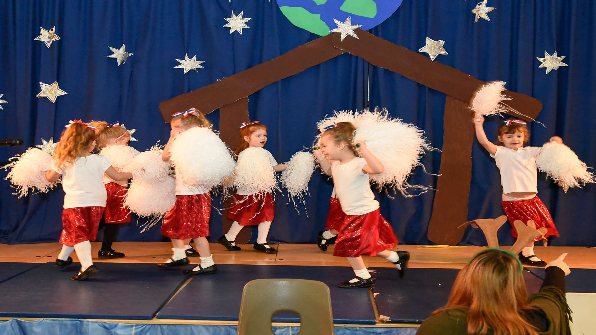 Reception pupils at Green Park Primary School in Dover have fun on stage