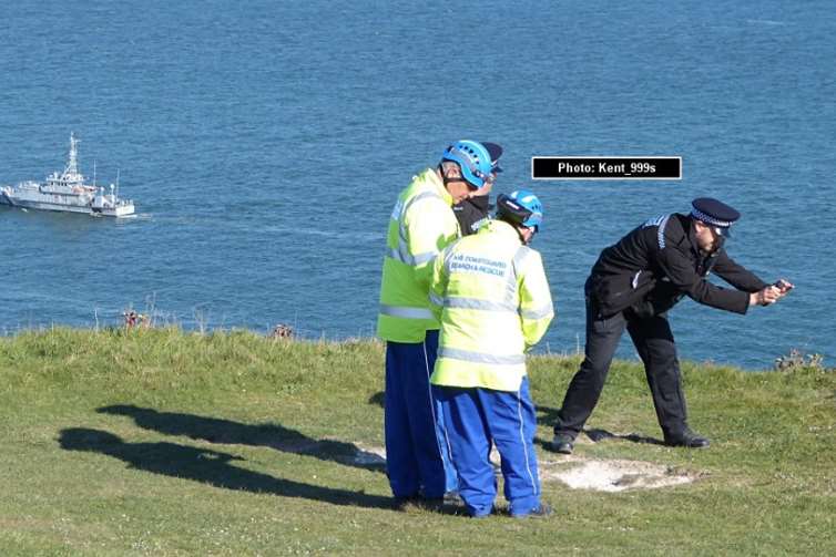 Police take a picture of the cliff edge during the search Picture: @kent999s
