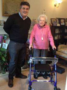 Daniel Ball, of First Choice Mobility, with Freda McGregor and her new walking frame