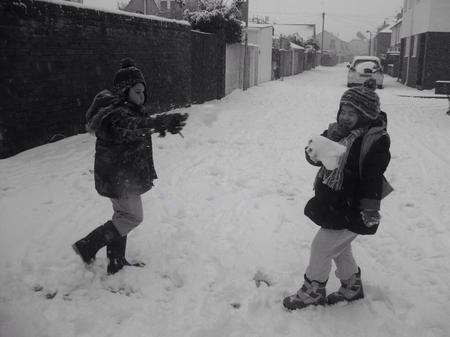 Siblings Max and Grace Kelly enjoy a snowball fight in Deal