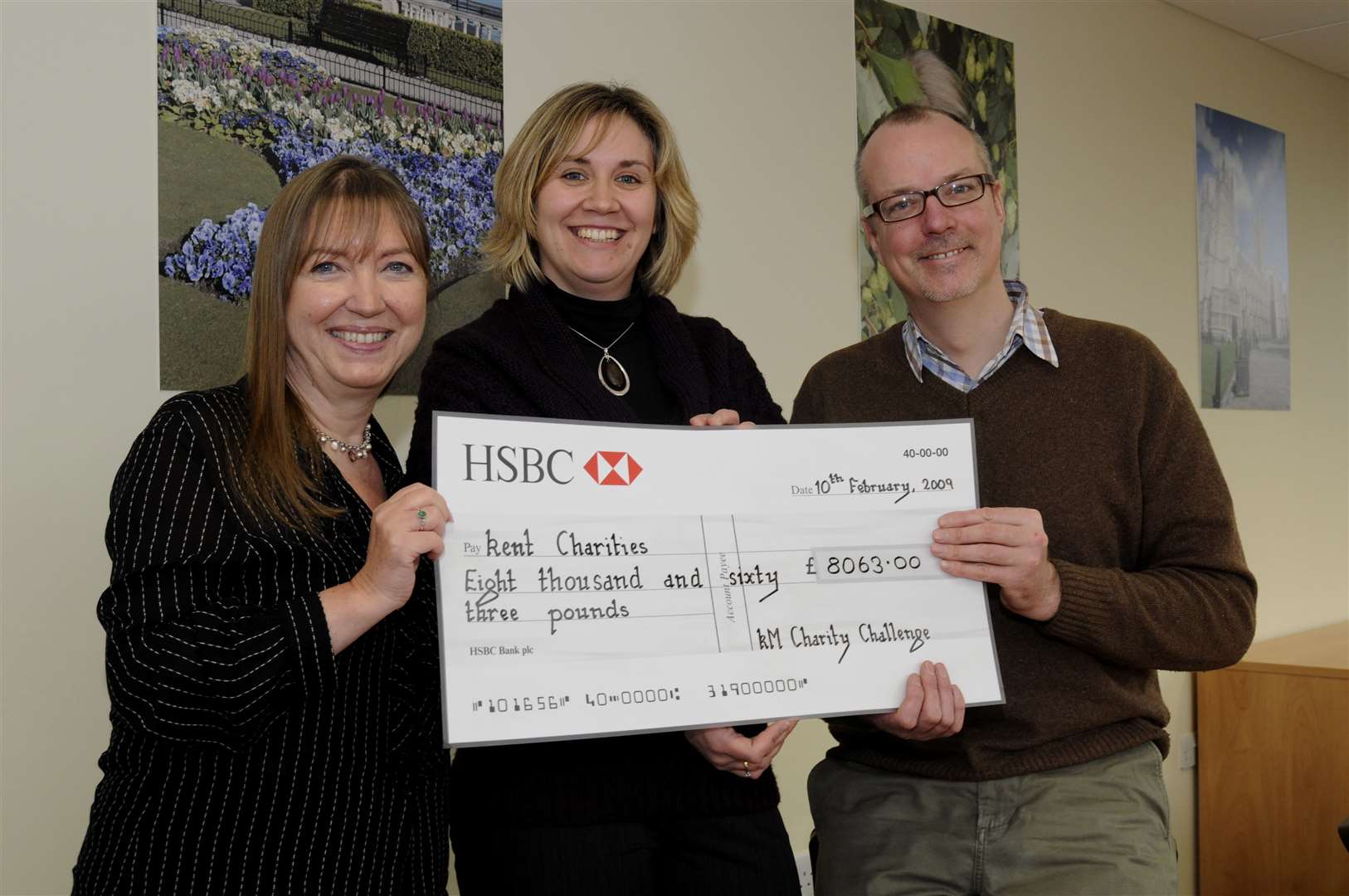 Carol Davies, left, presents Paula Ray of Walking Bus and Dan Powell of Clic Sargent with a giant cheque in 2009. Picture: Paul Amos