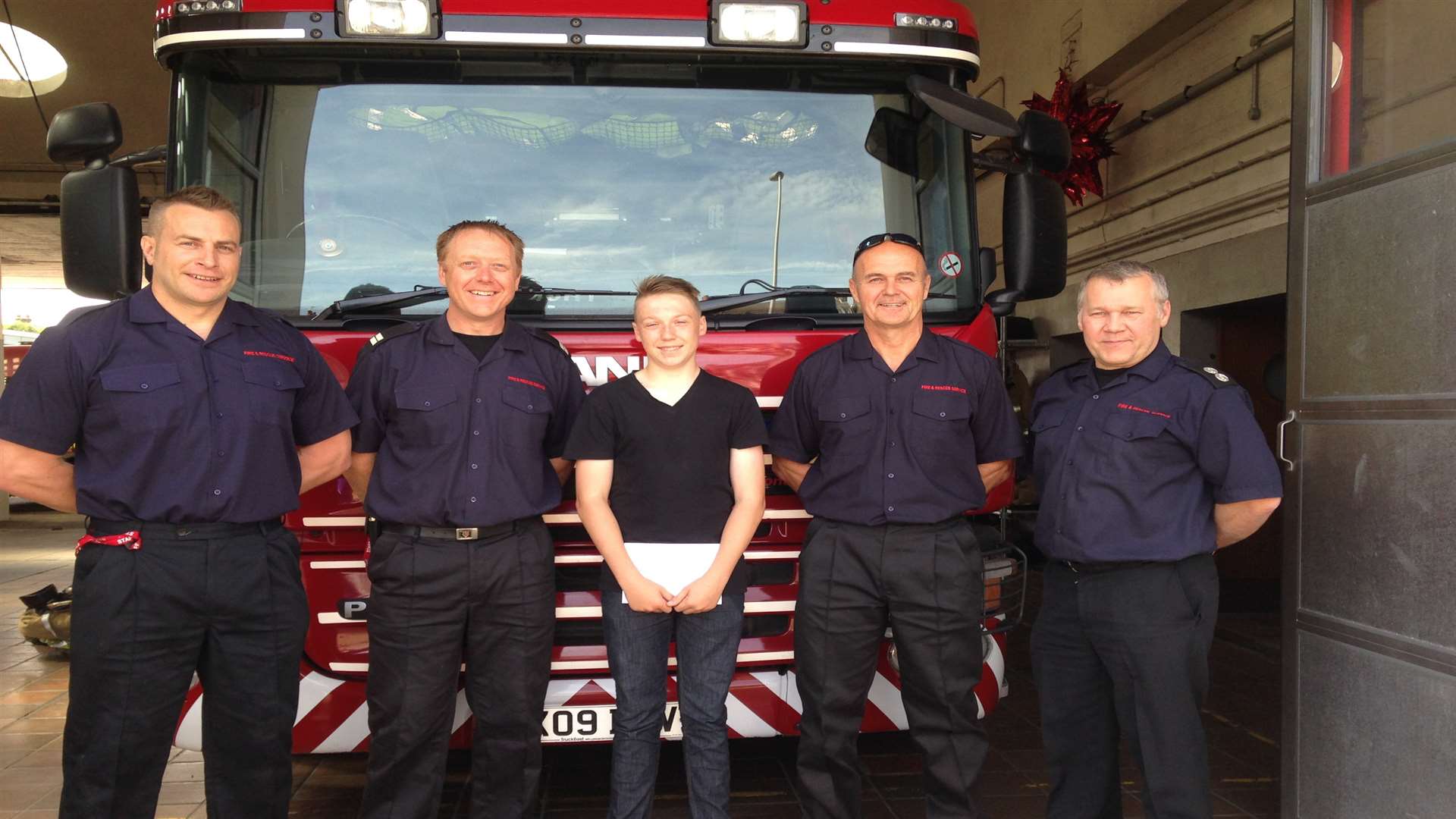 Ryan Smith, 16, with members of Red Watch at Medway Fire Station