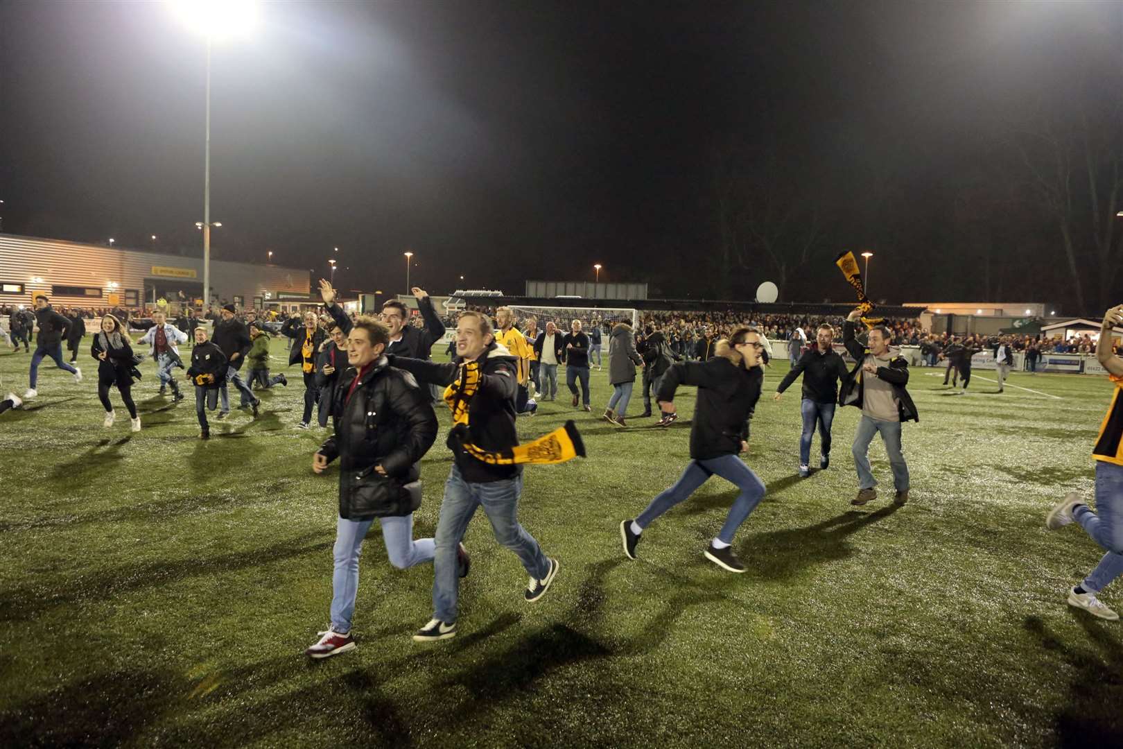Fans invade the pitch after the final whistle against Stevenage Picture: Martin Apps