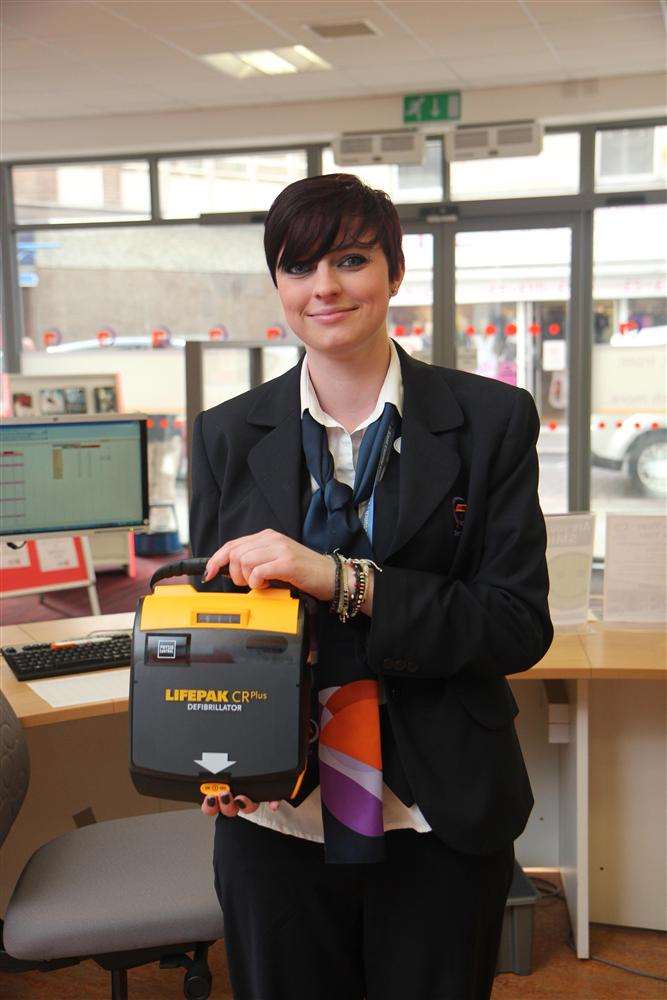 Kirsty Leigh, customer services assistant, with the defibrillator at Sheppey Gateway