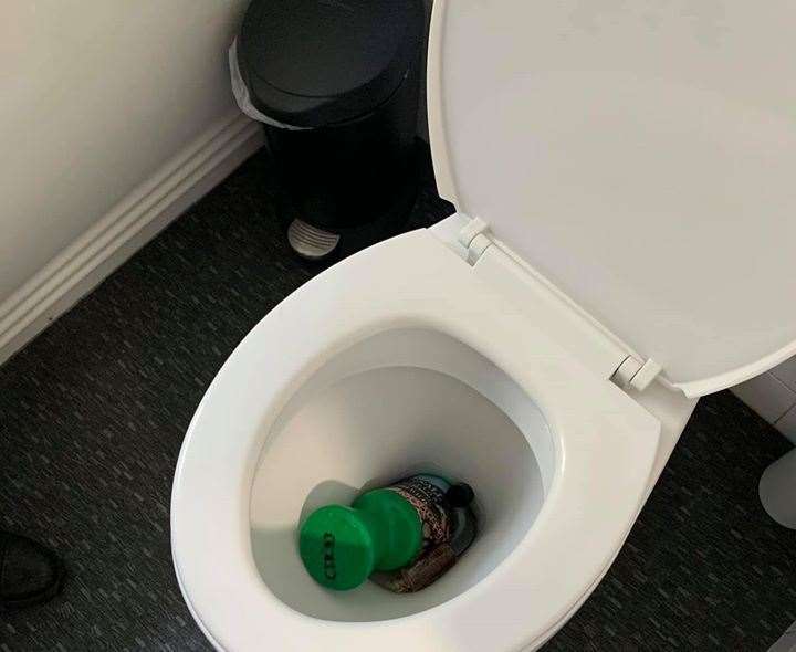 Quirk emptied a charity collection container and then threw it down the toilet
