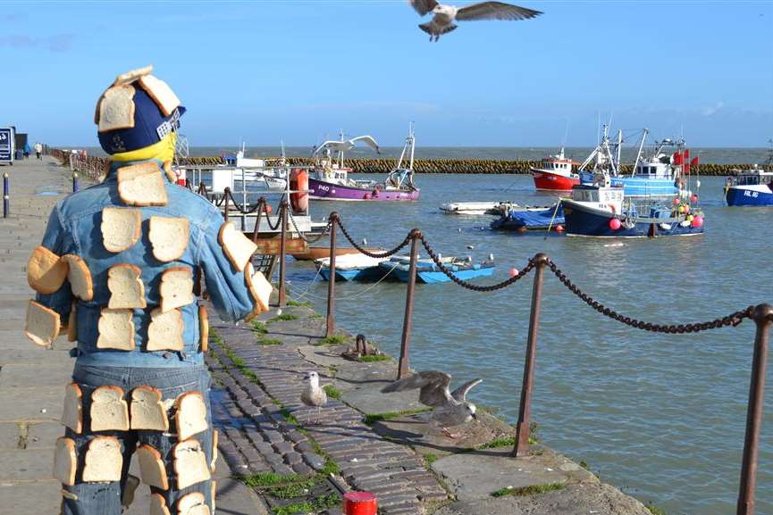 Ashley Main walks among Folkestone’s seagulls covered in bread