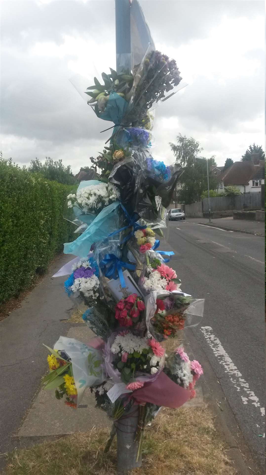 A tower of bouquets left at the scene