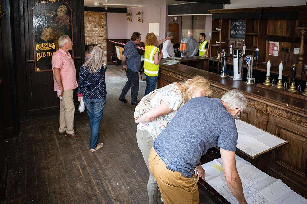 Visitors take a look around the pub which has been bought by the community (2385150)