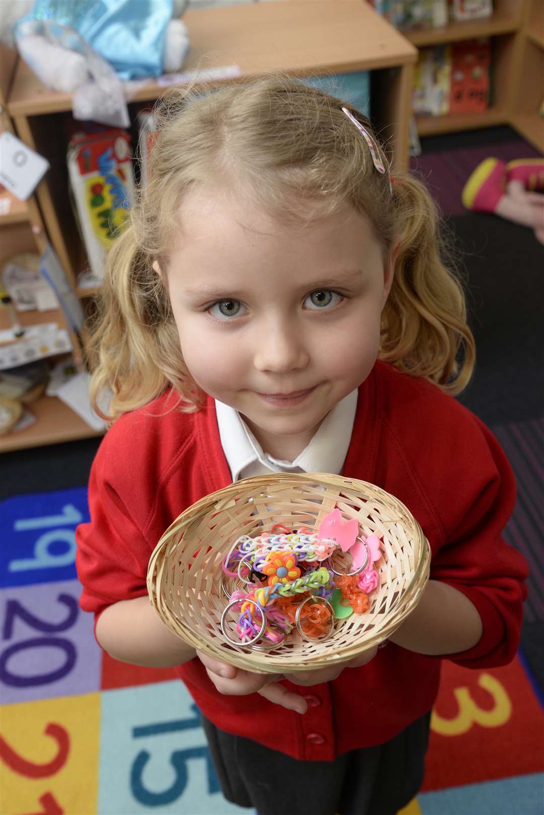 Scarlett, four, with loom band keyrings made in class