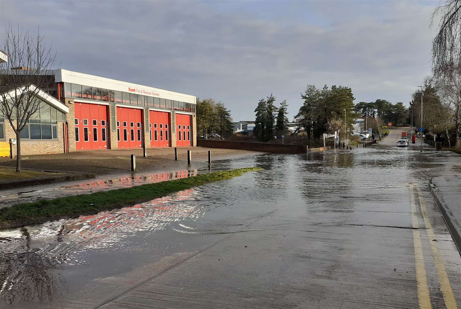 The water has built up at the entrance to the Henwood Industrial Estate. Picture: Andy Clark