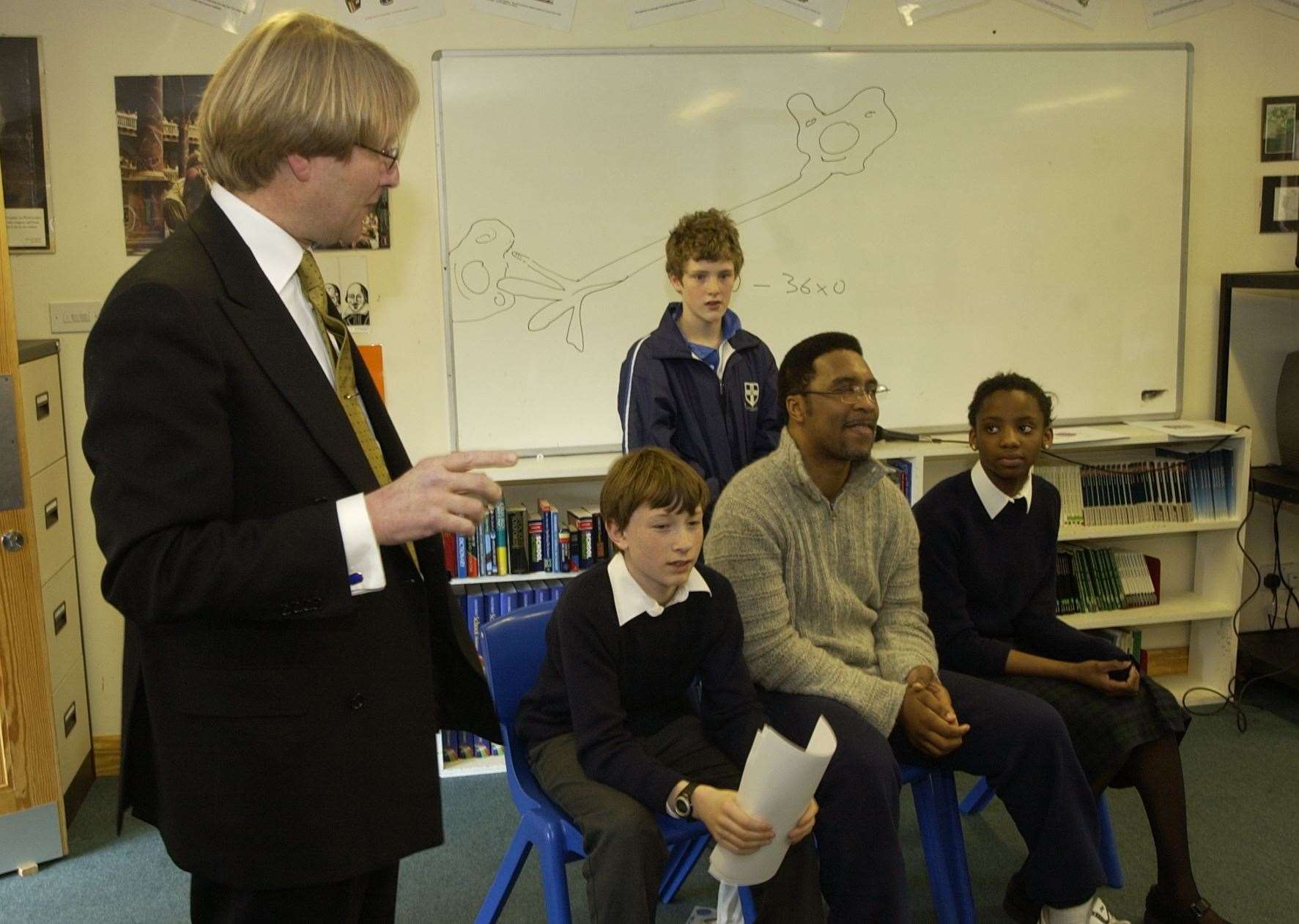 Neurosurgeon Peter Hamlyn and Boxer Michael Watson visit Junior King's School in 2003, to talk to pupils about head injuries