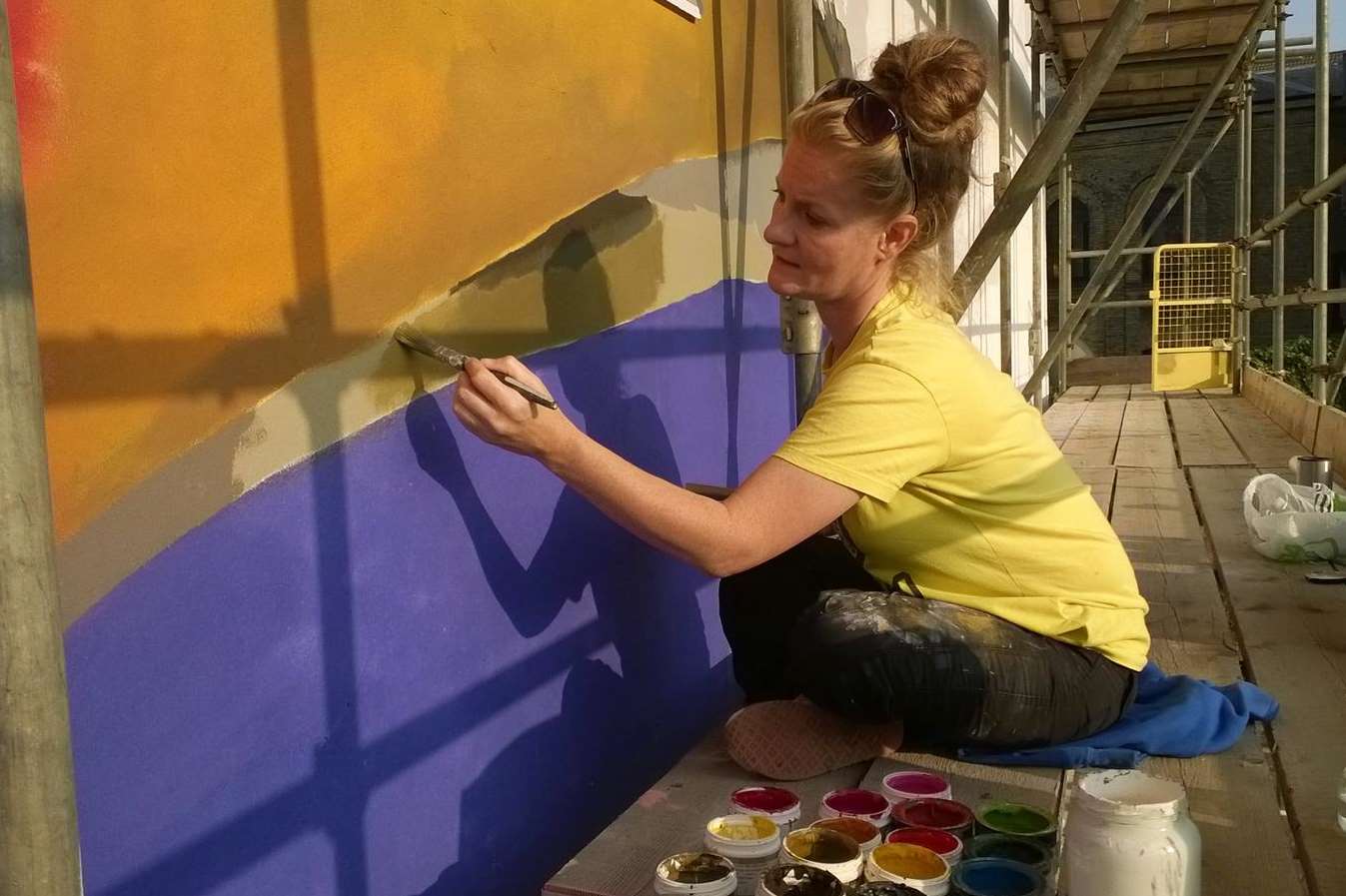 Artist Leigh Mulley hard at work on the seagull mural. Picture: Sam Millen