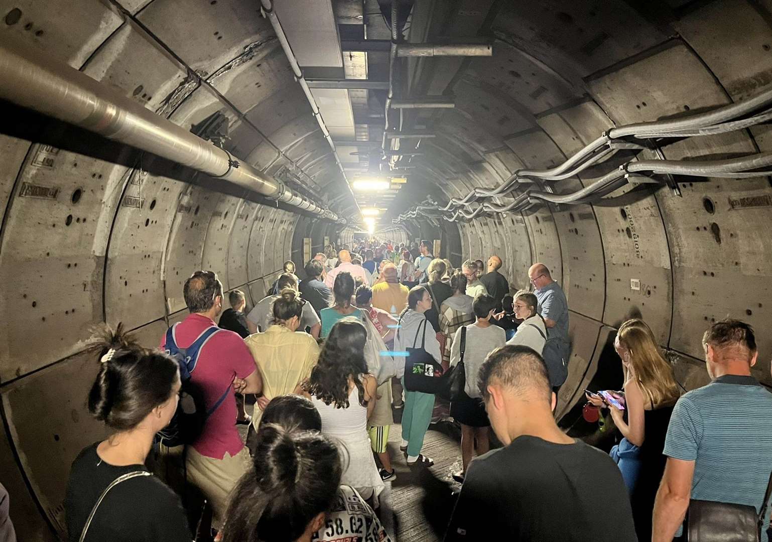 Passengers in an emergency tunnel after a Eurotunnel train broke down yesterday. Photo: PA Media/Kate Scott/Twitter