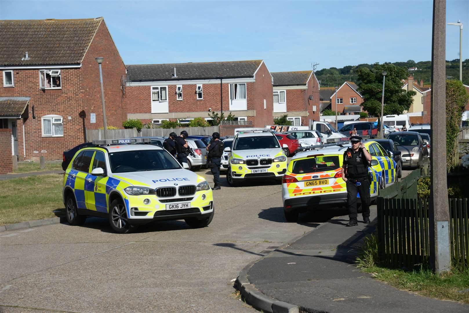 The mass of police vehicles at Seasalter. Picture: Chris Davey.