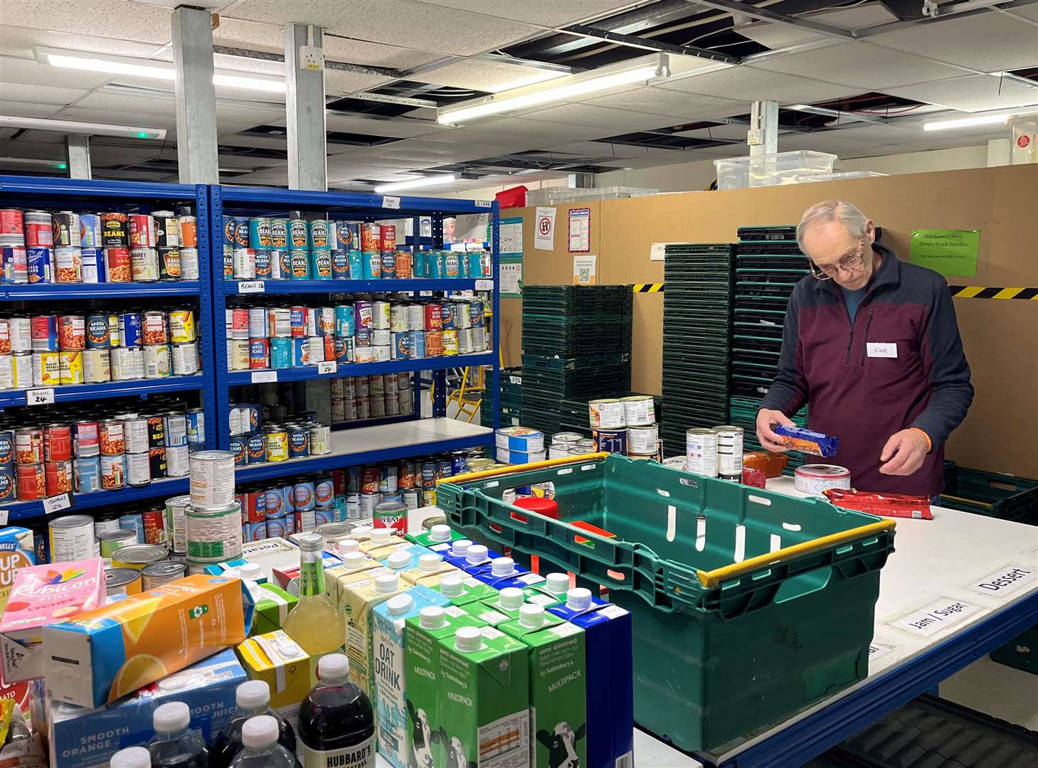 A volunteer at Canterbury Food Bank, which has seen demand soar over the past year