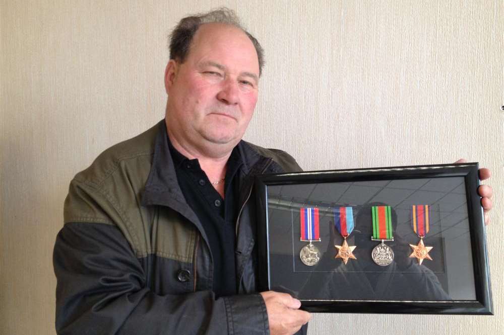 Colin Barker with the medals his father earned during the Second World War