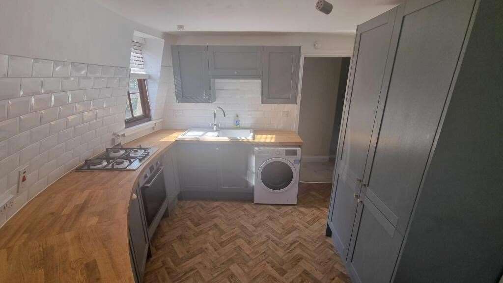 Not many homes have a kitchen counter designed to match it’s curves. Picture: Kent Sales and Lettings
