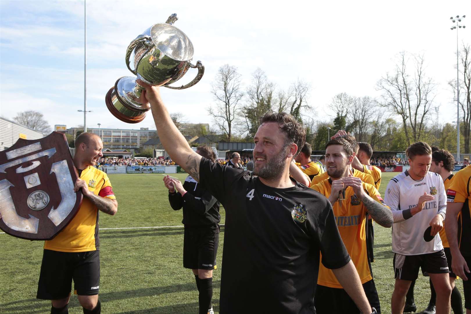 Jay Saunders with the league trophy Picture: Martin Apps