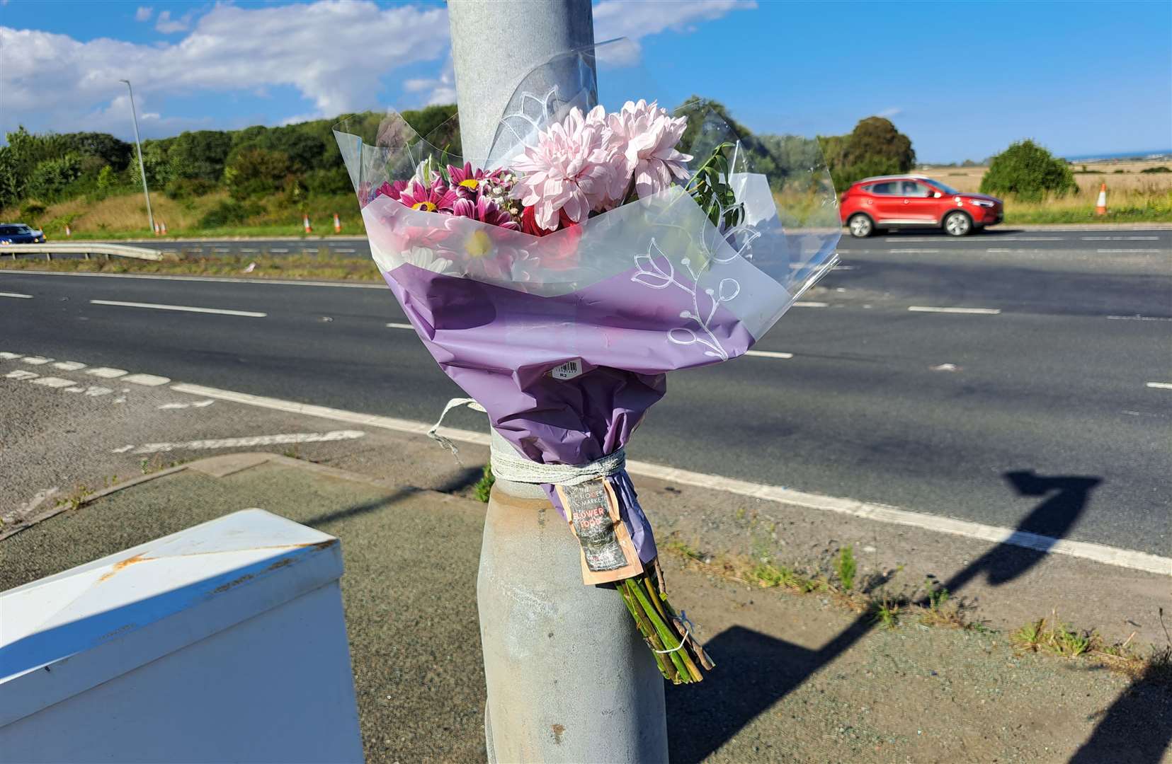 Flowers have been left at the scene following the crash on Sunday
